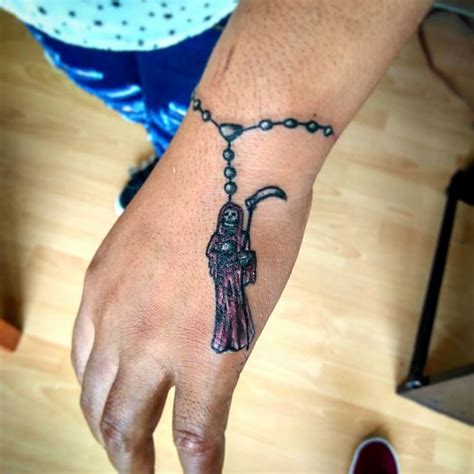 tatuajes de la santa muerte en la mano